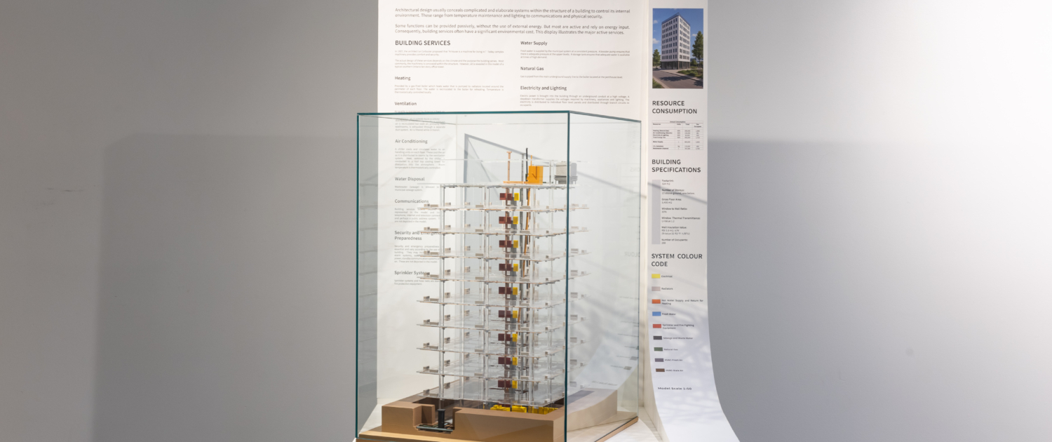 20250820-151856-THM-TodmordenMills-CanadianMuseumOfArchitecture-AndrewWilliamson-6953 The Comfort for All display on the exhibition floor, showing a model of a building with no walls and transparent floors, revealing its internal mechanical services.